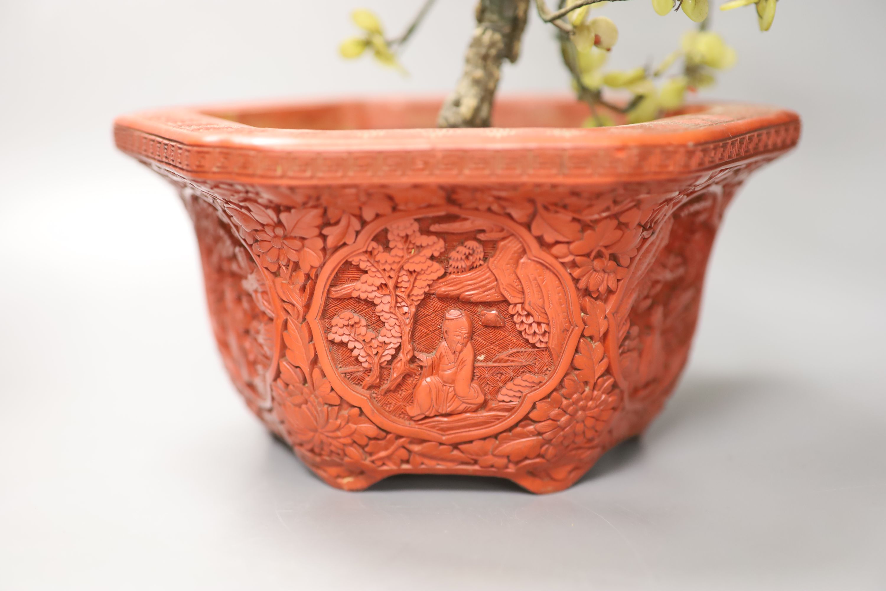 A Chinese hardstone miniature tree in hexagonal cinnabar lacquer jardiniere and a lacquered pewter tea caddy